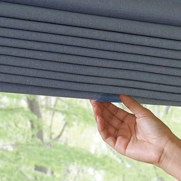 person pulling down shades